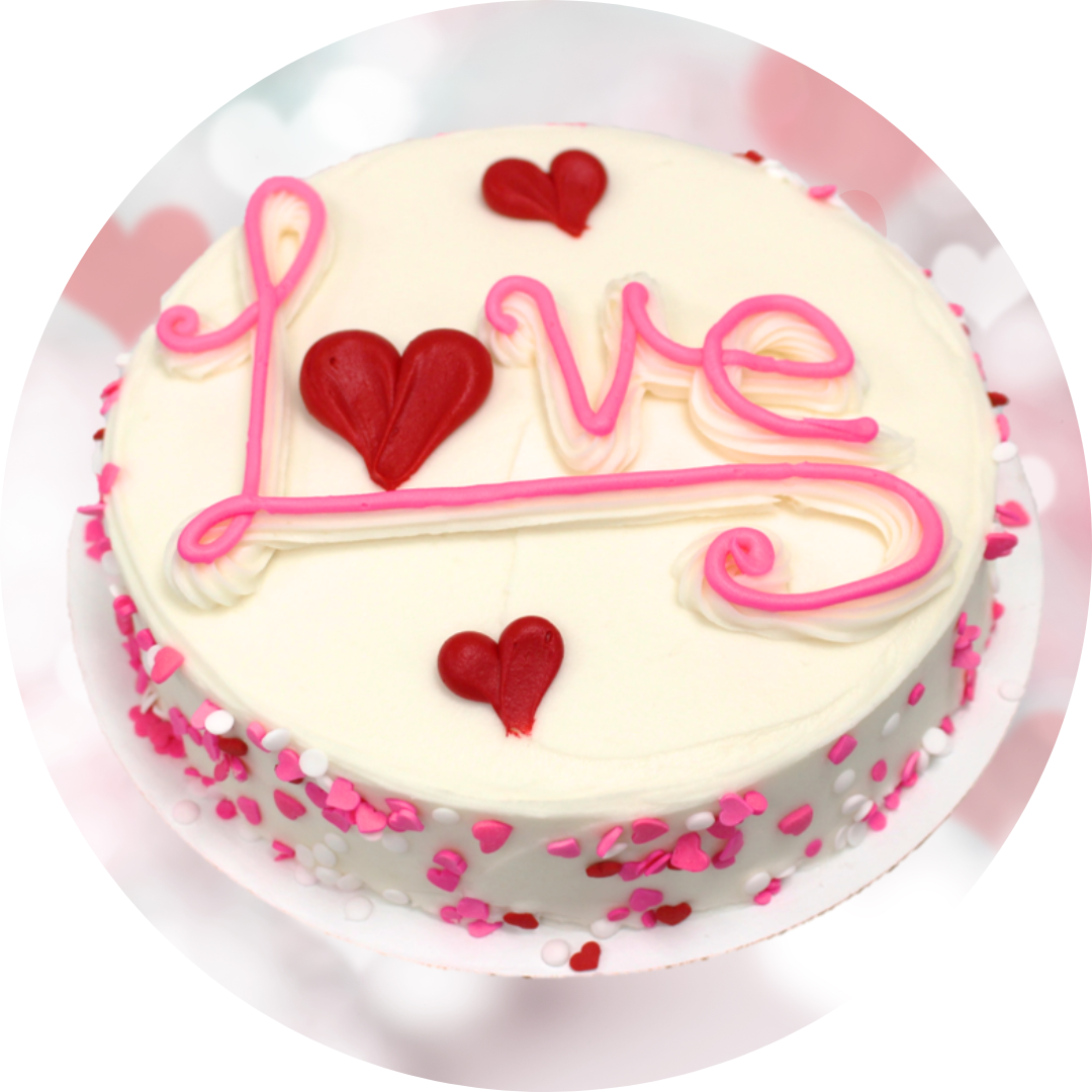 Pink, red, & white cake with "Love" written on top