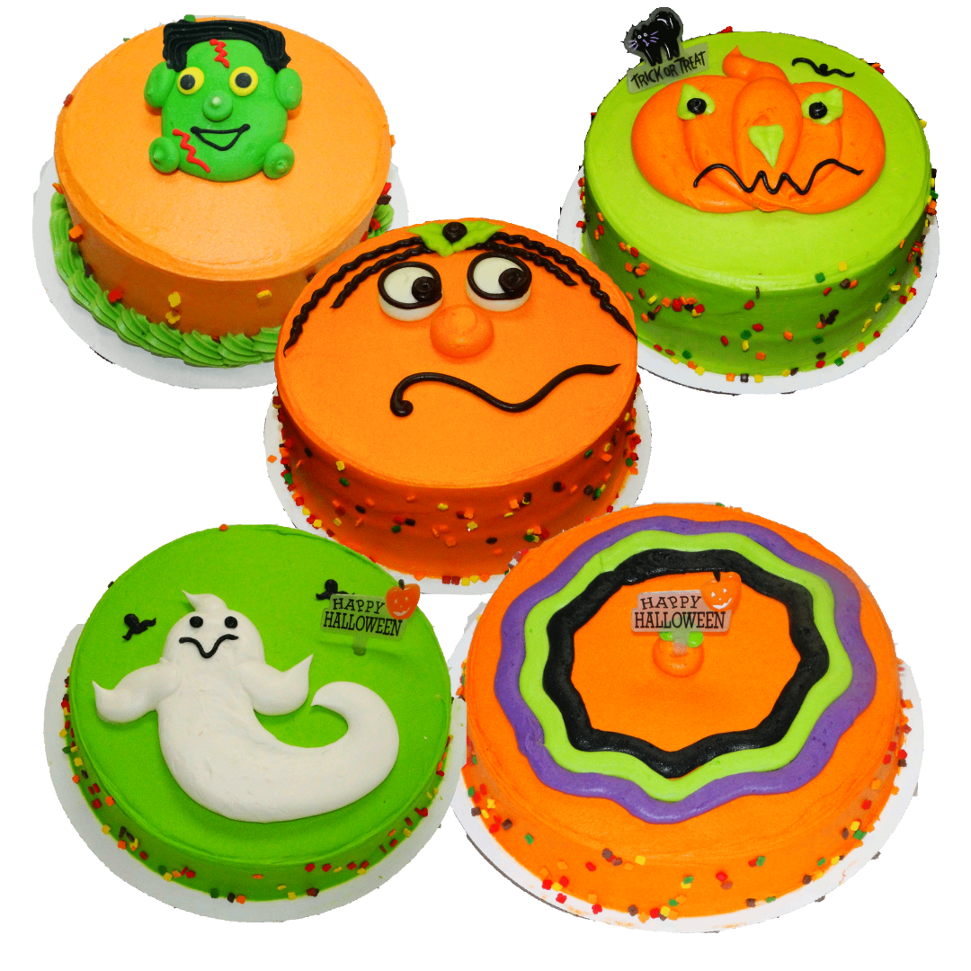 Five halloween cakes with various thematic decorations