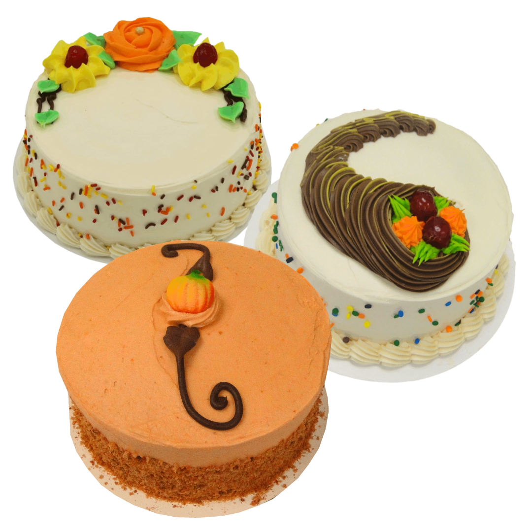Three Thanksgiving cakes with various thematic decorations