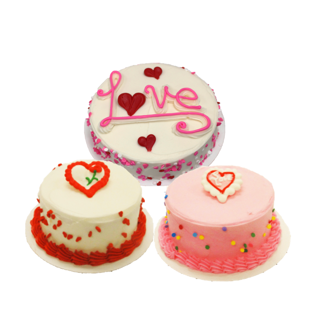 Four Valentine's Day cakes with various pink, red, and white decorations
